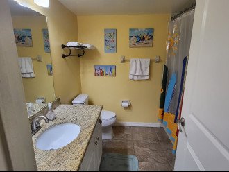 The main bathroom with tub/shower combo, is adjacent to 2nd bedroom and hallway