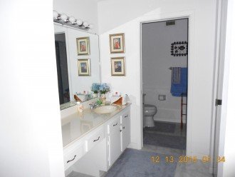 master bedroom vanity and private bathroom