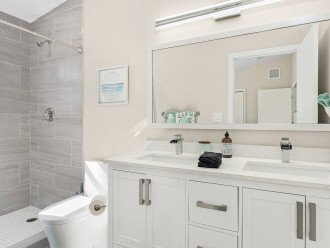 Bright and welcoming with a large mirror in which to perfect your look before you head to the beach.
