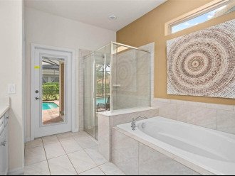 walk in shower and large bath tub