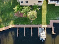 Canal home, boat ramp, dock, trailer parking, golf cart, kayak, EV charger!
