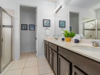 Dual vanity sinks with walk-in shower.
