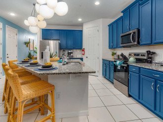This open colorful kitchen inspires fun!