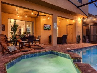 Spacious Outdoor Area with a TV so you can watch a movie while in the pool!