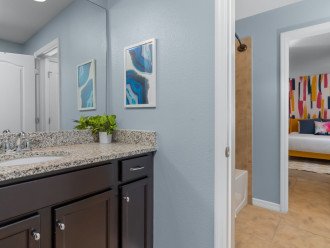 Jack and Jill Bathroom between Cars and Colorful King with a Bathtub/Shower
