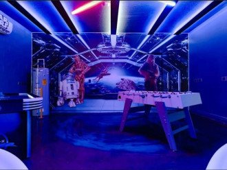 This Star Wars Game Room in the converted garage comes with A/C!