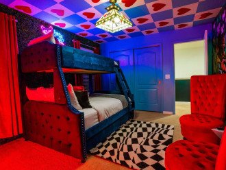 Queen of Hearts bedroom has a twin bed over a full bed and a 3rd twin bed can be pull-out under the full bed.