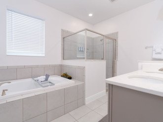Walk-in shower and jacuzzi bathtub in the master ensuite.