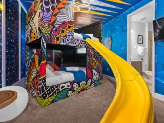 Bedroom 6: Black Panther Wakanda Forever with full over full bunkbeds.
