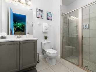 Bathroom attached to Moana's bedroom with walk-in shower with seat.