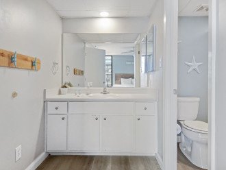 master on suite bathroom with tub/shower combo.