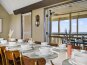 Indulge in the beauty and elegance of the decor while dining with friends and loved ones in this independent, bright dining area that comfortably seats 14.