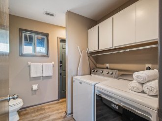 Modern and fully equipped laundry room.