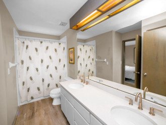 This full bathroom connects to a King bedroom and hallway. All bathrooms are bright and spacious, decorated in a sophisticated style.