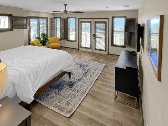 Experience spaciousness and personal space in the lower floor Master bedroom suite, equipped with all the modern comforts, TV, A/C and ceiling fan.