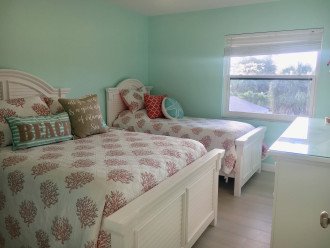Guest bedroom with full bed and twin bed