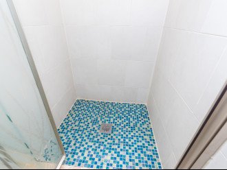 Tiled showers and seamless etched shower doors