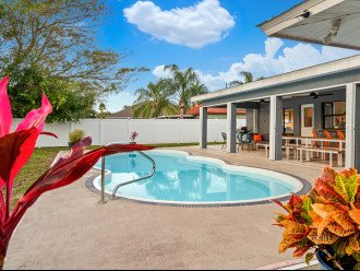 Surrounded by a beautifully landscaped yard, take a dip in the pool