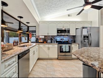 Cook and hang out with family in this spacious, open concept kitchen with island