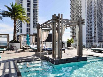Hyde's main pool deck features Costera Pool Bar, a hot tub, and lounge chairs along with several private cabanas available for rent