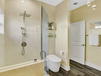 Step on into the ensuite bathroom, fitted with a LED rainfall walk in shower and smart toilet/bidet to pamper yourself each time you enter the bathroom.
