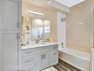 Welcome on into the 1st bedroom ensuite with a charming design to it, make use of the huge vanity area with a large mirror, perfect for getting ready in front of after your refreshing bath or shower! The choice is yours.