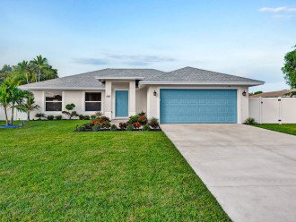 The front of your next newly constructed retreat! With a bright blue door and garage door to stand out, you can’t miss it! The moment you arrive here you will be comfortably invited by the green luscious grass with the front garden.