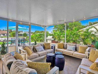 Move on inside with still the outdoor feel with this beautifully decorated screened porch area. With an abundance of seating for large groups - the perfect place to chill out on after a day in the sun.