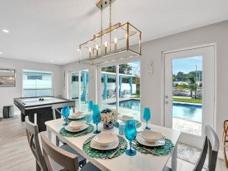 The dining room is the perfect place to sit down and savor meals made from the fully equipped kitchen - with pool views and good food - what more could you want?