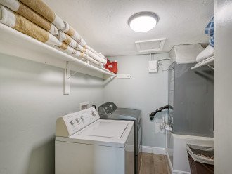 Full sized washer and dryer with beach towels provided