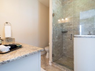 The spacious primary ensuite bathroom has a walk-in shower.