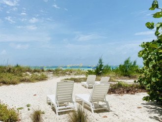 New chaise loungers on private beach of Sailfish Gulf Suites