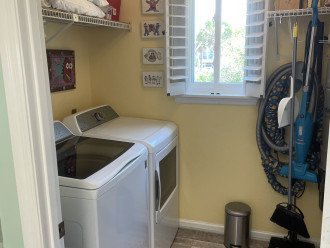 Laundry room with New GE Profile Washer/Dryer and central vacuum