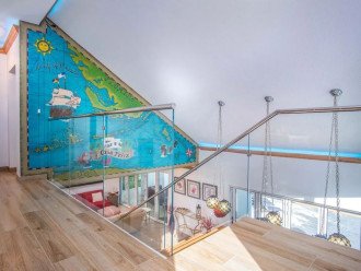 This second-floor walkway provides an open view to the mural and the space below