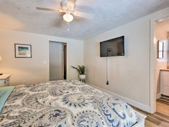 Master Bedroom with comfortable king bed and 40" wall-mounted TV w/ basic cable.