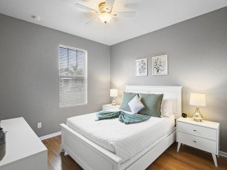 Find tranquility in this queen bedroom, where modern simplicity invites rest and rejuvenation.