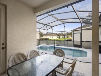 Delight in poolside dining within the comfort of our screened lanai, blending indoor comfort with outdoor charm.