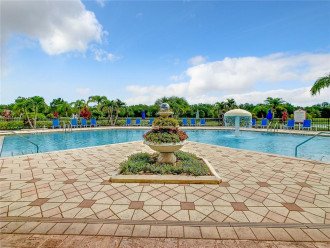Bask in the Florida sunshine and take a refreshing dip in our sprawling community pool, a central spot for relaxation and fun.
