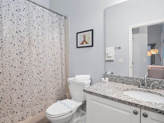 Third bathroom, shower over bath