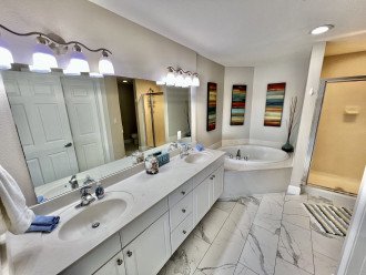 Master bath with double vanity, soaking tub and walk in shower