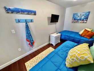 Aquarium Room with two twin beds and smart TV