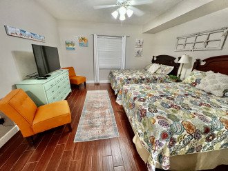 Roomy and comfortable bedroom with two queen beds with updated mattresses.