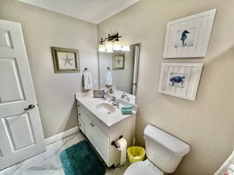 En-suite bathroom iwth tub shower combo.