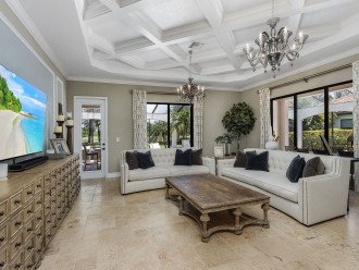 Family Room with comfortable furnishings and travertine floors
