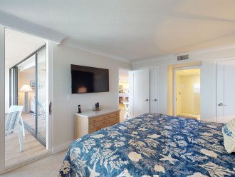 Primary suite with sliding door to Lanai - Wake up to water views!