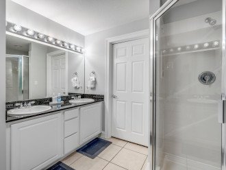 Large tub and walk-in shower with dual vanities