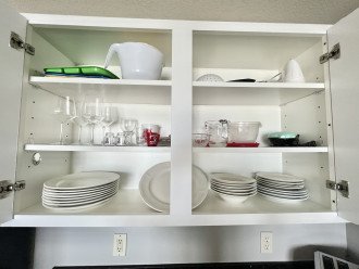 Fully stocked with pots, pans, dishes, silverware and glasses!