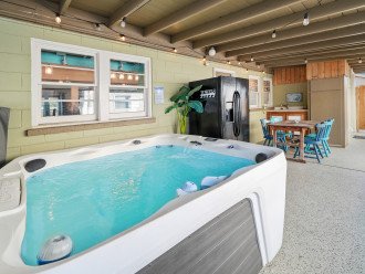 7-Person hot tub, plus second refrigerator, and card table under the covered carport. Perfect for quiet evenings and rainy days.