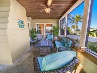 Get away from the bugs and out of the rain in our screened-in front porch, complete with propane fire pit. (Tank provided - propane gas not garaunteed)