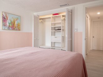 Bedroom 1, furnished with a queen-sized bed, includes a closet